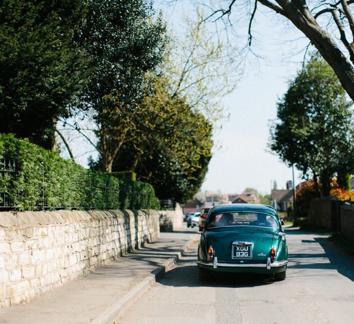 Green classic wedding car | Papakata Sperry Tent Wedding at family home | Sassi Holford Dress with added ivory Ostrich feathers to veil | Manolo Blahnik shoes | Images by Melissa Beattie