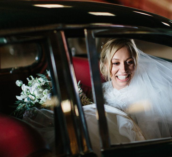 Green classic wedding car | Papakata Sperry Tent Wedding at family home | Sassi Holford Dress with added ivory Ostrich feathers to veil | Manolo Blahnik shoes | Images by Melissa Beattie