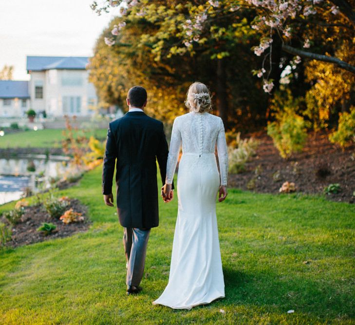 Papakata Sperry Tent Wedding at family home | Sassi Holford Dress with added ivory Ostrich feathers to veil | Manolo Blahnik shoes | Images by Melissa Beattie