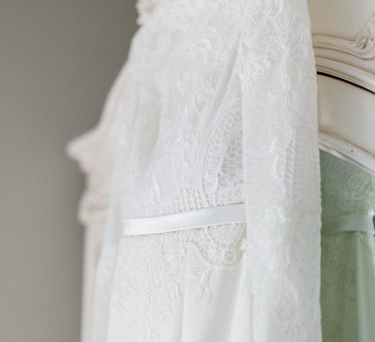 Lace dress detail | Papakata Sperry Tent Wedding at family home | Sassi Holford Dress with added ivory Ostrich feathers to veil | Manolo Blahnik shoes | Images by Melissa Beattie