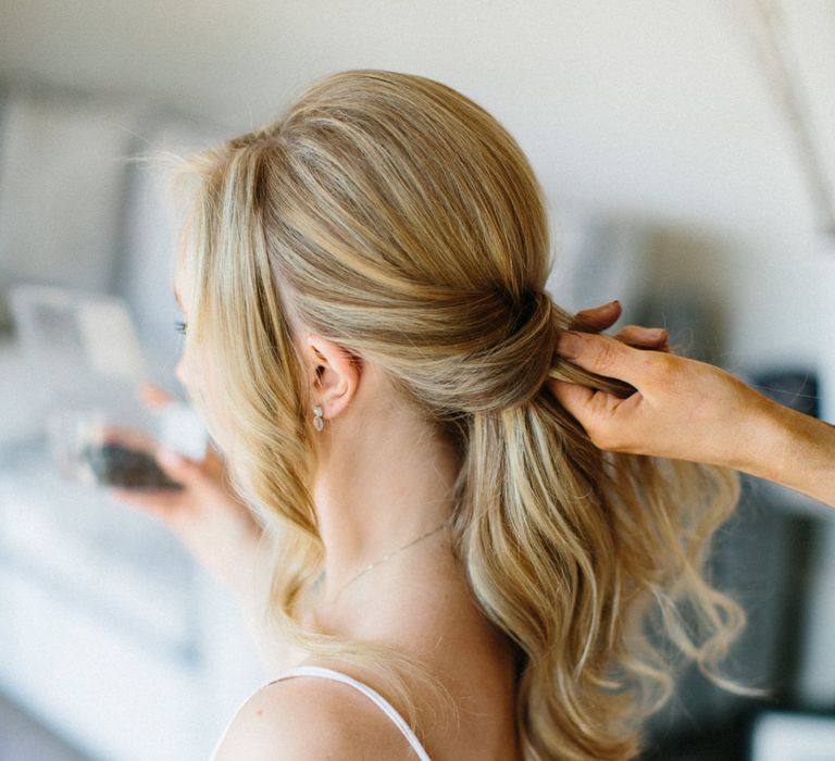 Loose romantic updo for Bride | Papakata Sperry Tent Wedding at family home | Sassi Holford Dress with added ivory Ostrich feathers to veil | Manolo Blahnik shoes | Images by Melissa Beattie