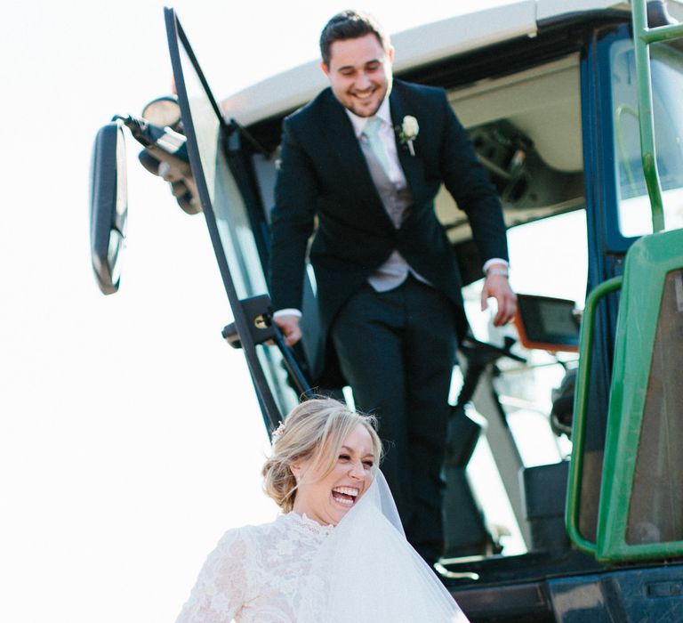 Farm wedding tractor ride | Papakata Sperry Tent Wedding at family home | Sassi Holford Dress with added ivory Ostrich feathers to veil | Manolo Blahnik shoes | Images by Melissa Beattie