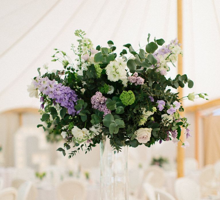 White, green and lilac flowers | Papakata Sperry Tent Wedding at family home | Sassi Holford Dress with added ivory Ostrich feathers to veil | Manolo Blahnik shoes | Images by Melissa Beattie