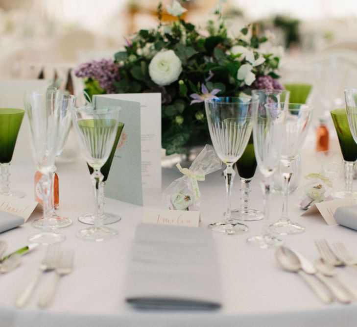 White, green and lilac flowers | Papakata Sperry Tent Wedding at family home | Sassi Holford Dress with added ivory Ostrich feathers to veil | Manolo Blahnik shoes | Images by Melissa Beattie