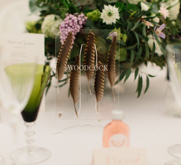 Feathers placed in acrylic table names | Papakata Sperry Tent Wedding at family home | Sassi Holford Dress with added ivory Ostrich feathers to veil | Manolo Blahnik shoes | Images by Melissa Beattie