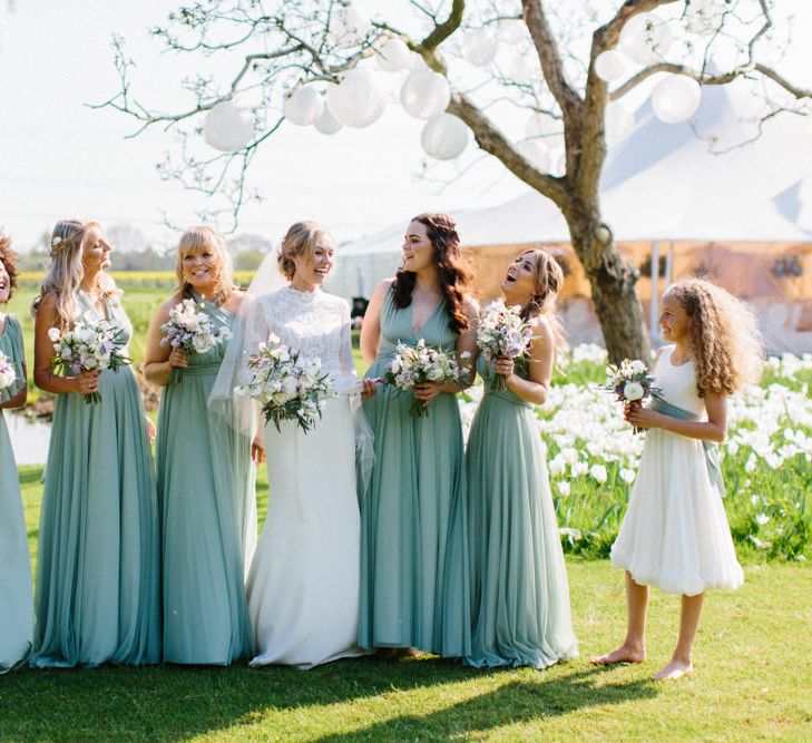 Twobirds Bridesmaid dresses in green | Papakata Sperry Tent Wedding at family home | Sassi Holford Dress with added ivory Ostrich feathers to veil | Manolo Blahnik shoes | Images by Melissa Beattie