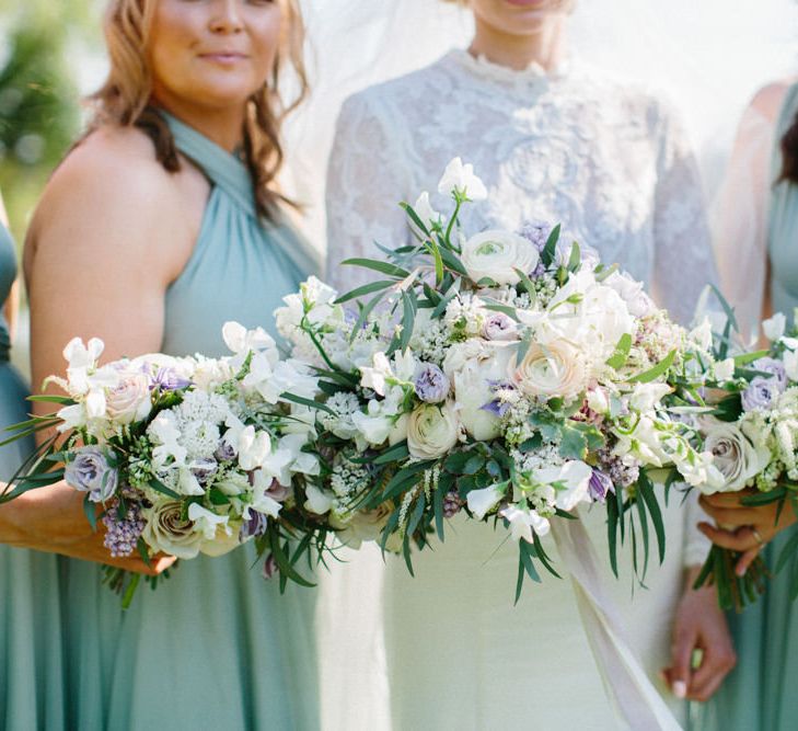 Twobirds Bridesmaid dresses in green | Papakata Sperry Tent Wedding at family home | Sassi Holford Dress with added ivory Ostrich feathers to veil | Manolo Blahnik shoes | Images by Melissa Beattie