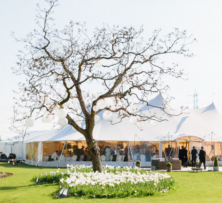 Papakata Sperry Tent Wedding at family home | Sassi Holford Dress with added ivory Ostrich feathers to veil | Manolo Blahnik shoes | Images by Melissa Beattie