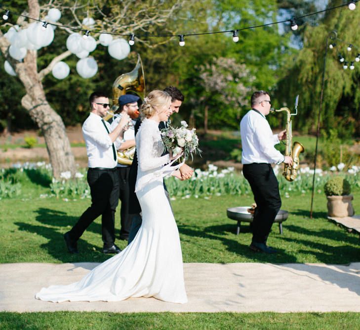 Papakata Sperry Tent Wedding at family home | Sassi Holford Dress with added ivory Ostrich feathers to veil | Manolo Blahnik shoes | Images by Melissa Beattie