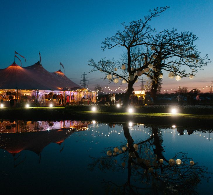 Festoon lighting | Papakata Sperry Tent Wedding at family home | Sassi Holford Dress with added ivory Ostrich feathers to veil | Manolo Blahnik shoes | Images by Melissa Beattie