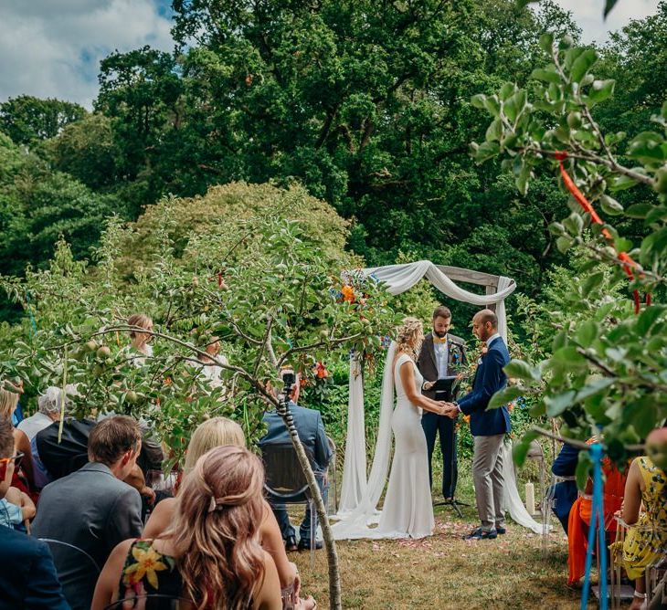 Outdoor ceremony with bright wedding decorations