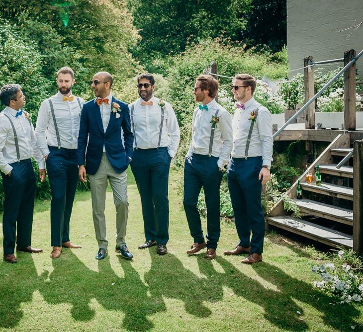 Groomsmen in matching outfits and colourful bowties