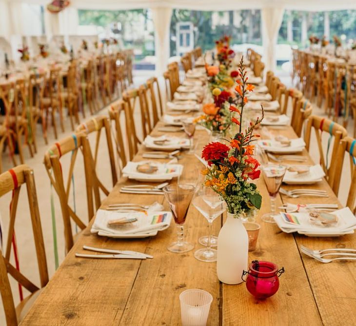 Beautiful bright wedding decorations with colourful flowers for tables