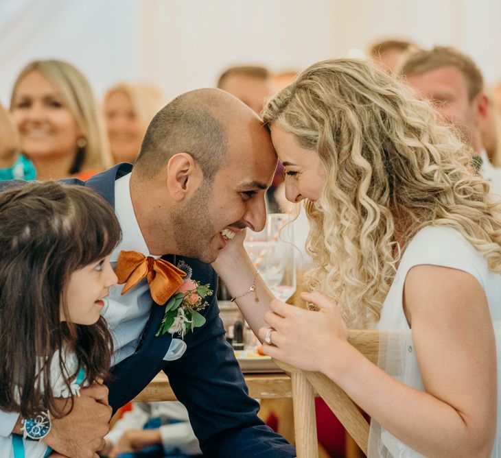 Bride and groom steal a moment during wedding reception