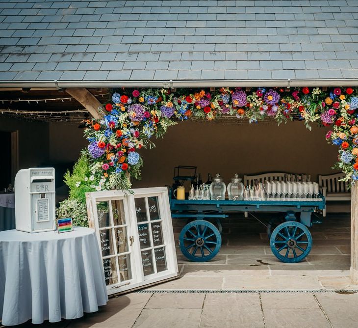 Colourful wedding flowers and gin bar at Dartmoor wedding venue