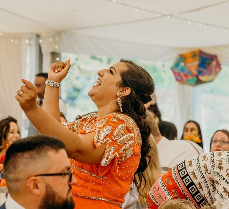 Guests enjoy wedding entertainment