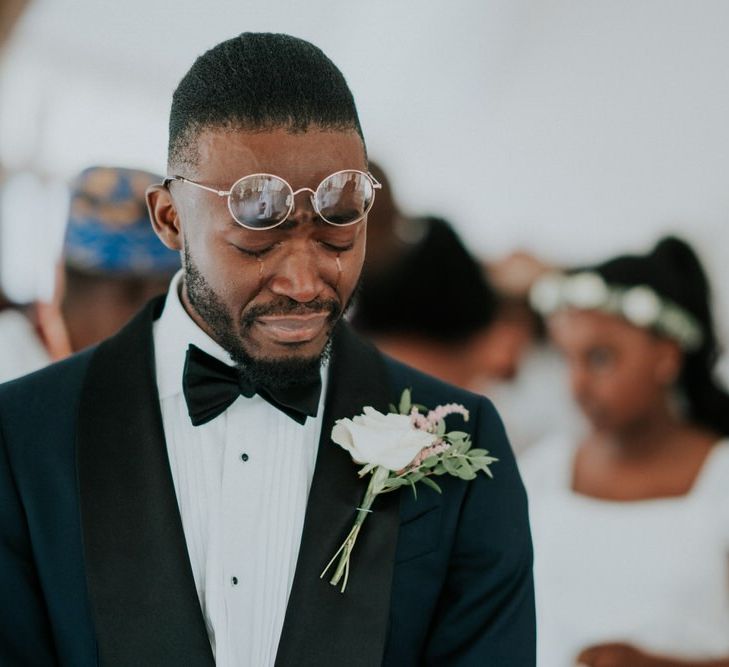 Tearful groom as his bride enters the wedding ceremony