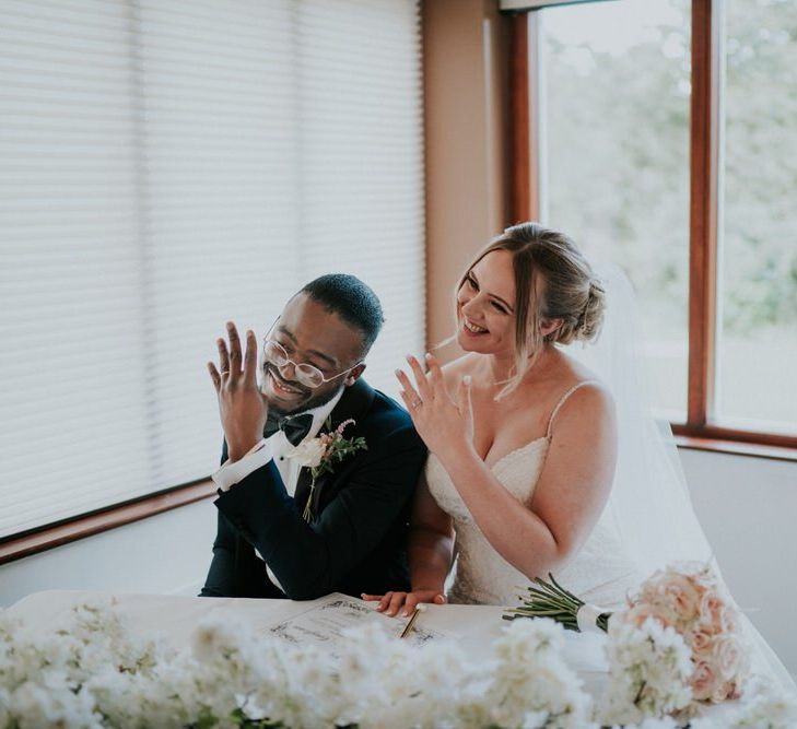 Bride and groom signing the register