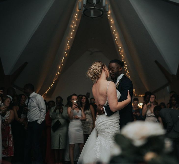 Bride and groom first dance portrait with bride in Morilee wedding dress