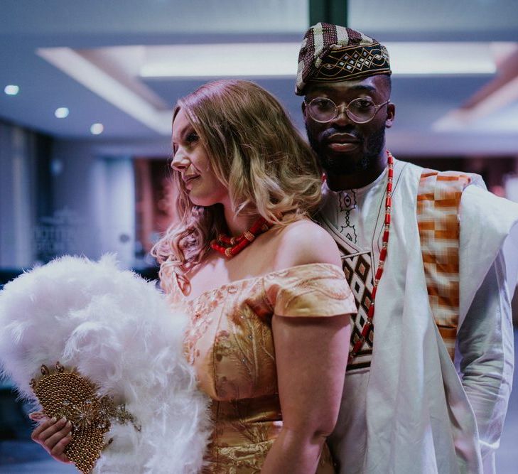 Bride and groom in traditional Nigerian Yoruba outfits