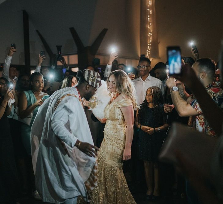 Bride and groom on the dance floor in Nigerian Yoruba outfits