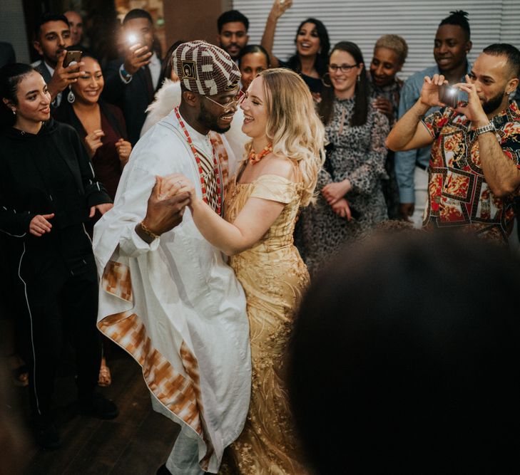 Bride and groom on the dance floor in Nigerian Yoruba outfits