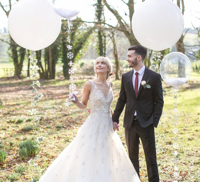 Giant Balloon Props For Wedding Photographs // Gingerbread House For A Festive Christmas Wedding With Red And White Florals Stag Motif Stationery Planned &amp; Styled By La Fete Anneli Marinovich Photography