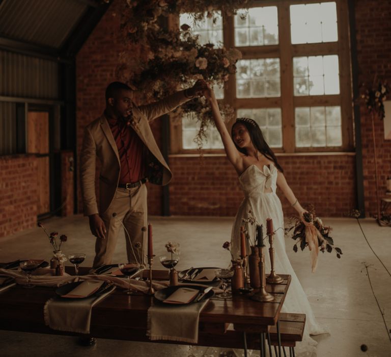 Bride and groom dancing in the Giraffe Shed wedding venue