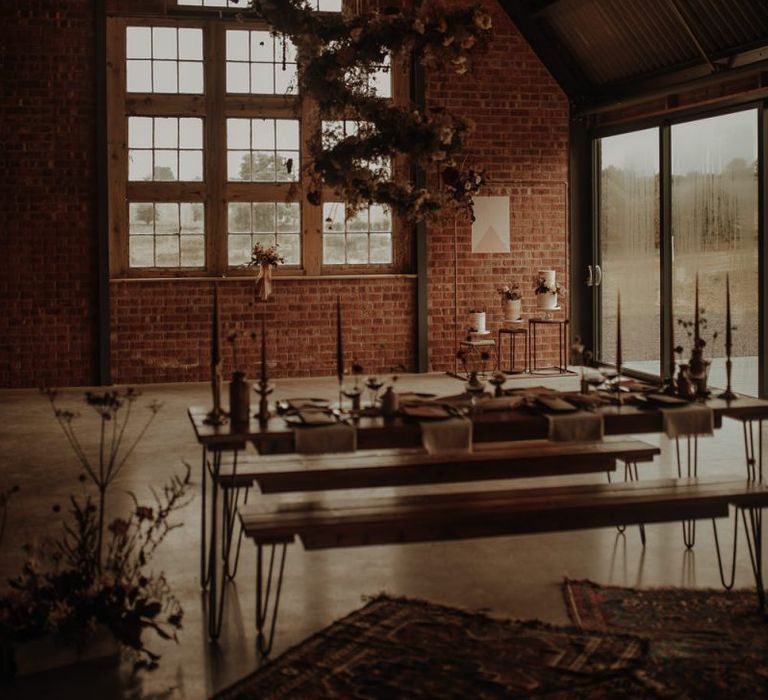 Contemporary reception table decor at the Giraffe Shed with spiral flower installation