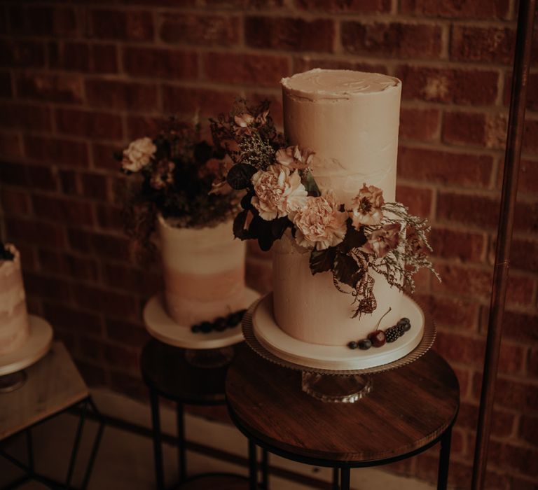 Two tier buttercream wedding cake with flowers