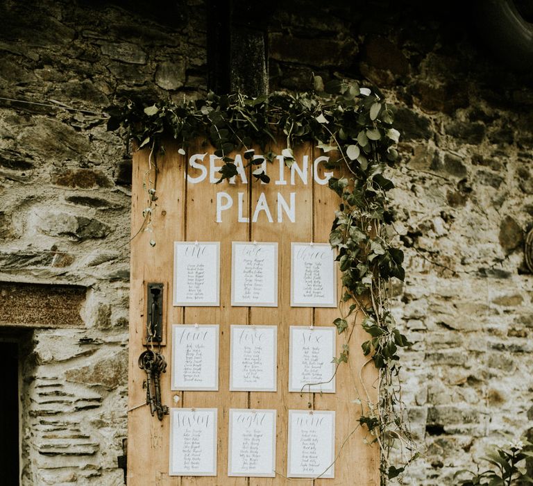 Wooden Door Seating Plan // Glasshouse Wedding At Anran In Devon // Image By Paige Grace Photography // Film By The Wild Bride