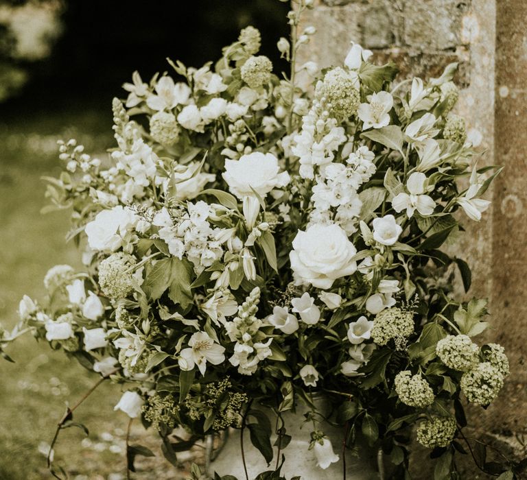 Floral Arrangements In Milk Churns For Wedding // Glasshouse Wedding At Anran In Devon // Image By Paige Grace Photography // Film By The Wild Bride