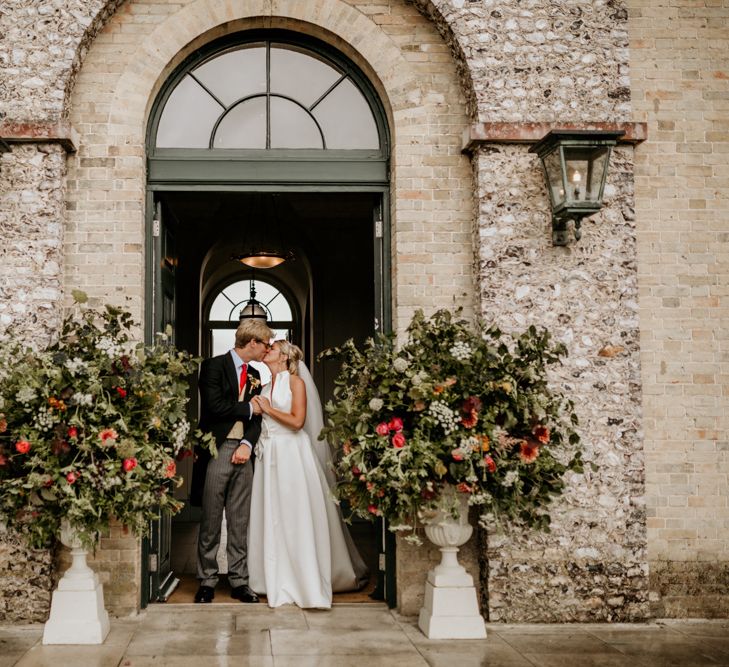 Large Floral Displays In Urns // Image By Green Antlers Photography