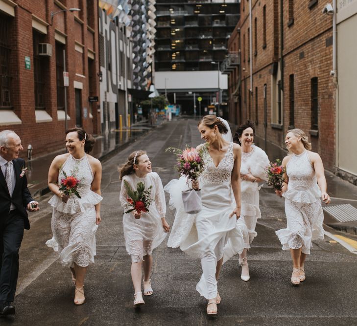 Bridesmaid in white peplum dresses at Australian wedding