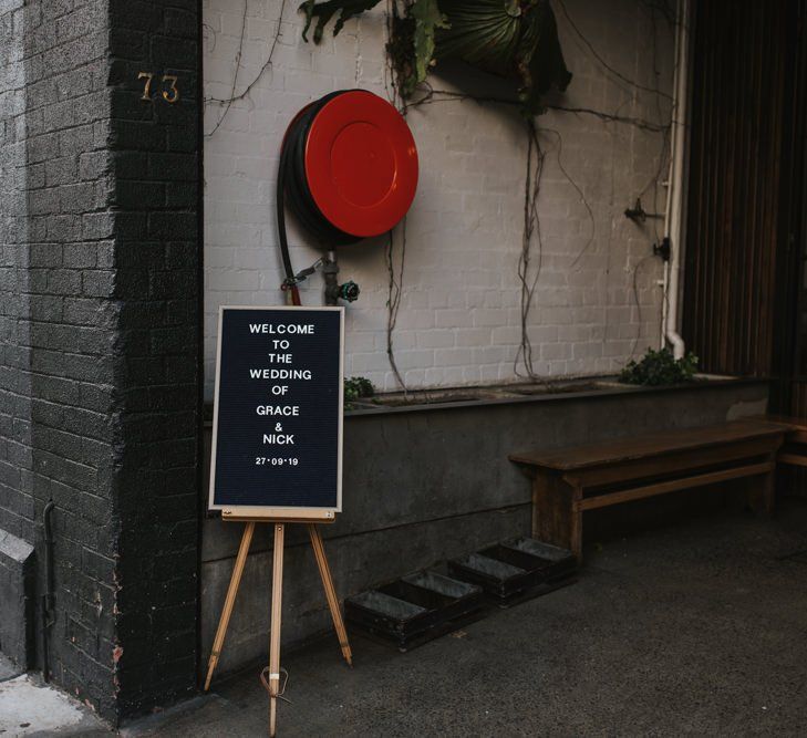 Peg board welcome sign at Australian wedding in Melbourne venue