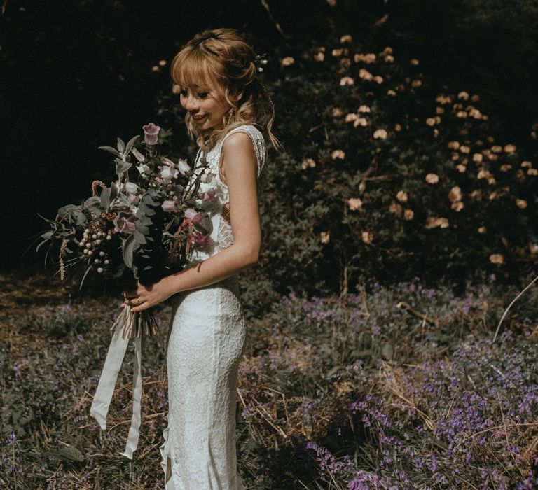 Beautiful Bride in Boho Lace Wedding Dress with Wildflower Bouquet