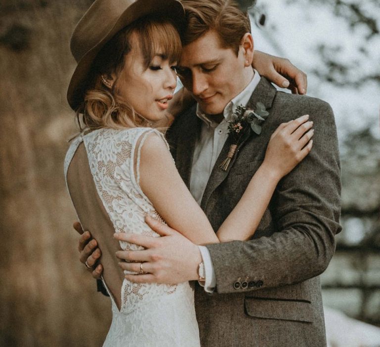 Groom in Wool Blazer and Bride in Lace Backless Wedding Dress and Felt Hat