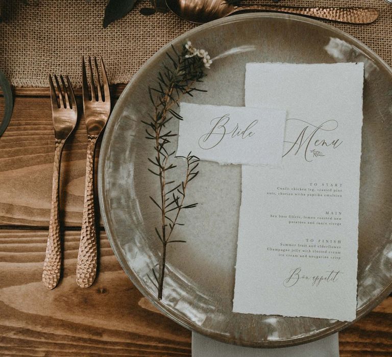 Place Setting with Charger Plate, Gold Flatware and Menu Card