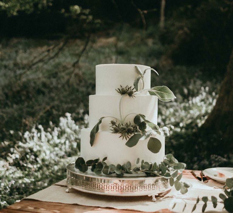 Three Tier White Wedding Cake with Eucalyptus Decor