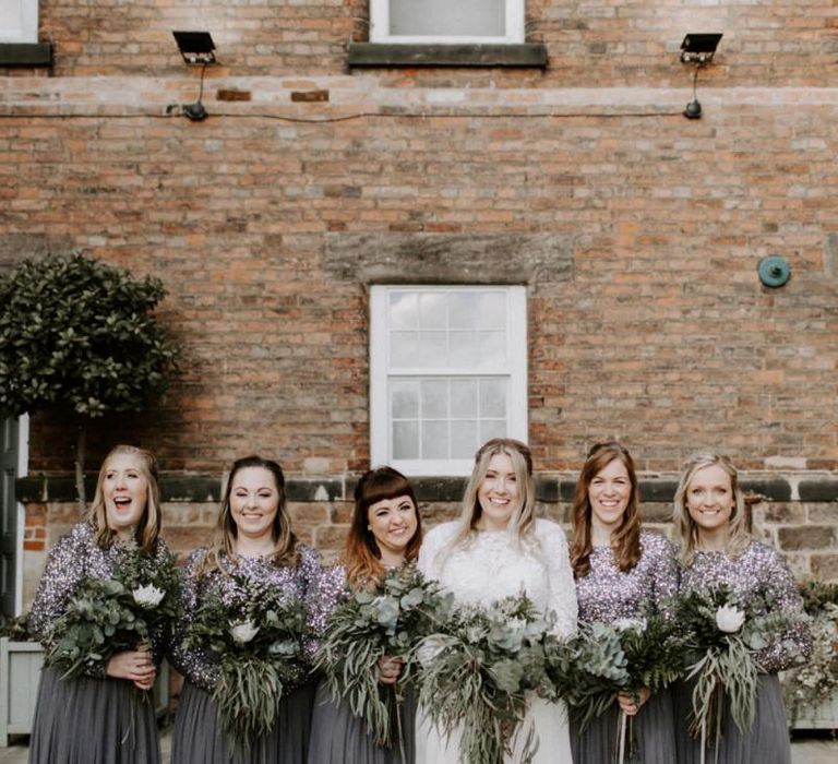 Bridesmaids in charcoal grey sequin dresses