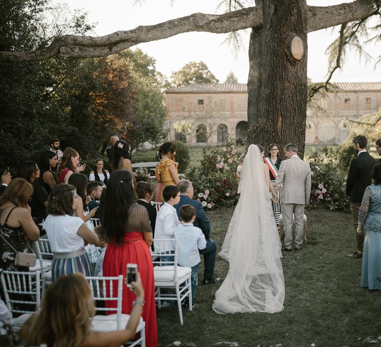 Outdoor Wedding Ceremony | Bride in Strapless Embroidered Wedding Dress by Rara Avis | Fairytale Tuscan Wedding with Bride in Embroidered Dress | Andrea &amp; Federica Photography