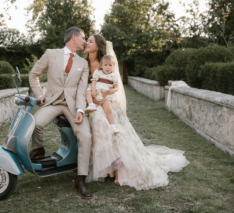 Blue Scooter | Bride in Strapless Embroidered Wedding Dress by Rara Avis | Groom in Beige Suit with Ochre Tie | Flower Girl in White Dress | Fairytale Tuscan Wedding with Bride in Embroidered Dress | Andrea &amp; Federica Photography