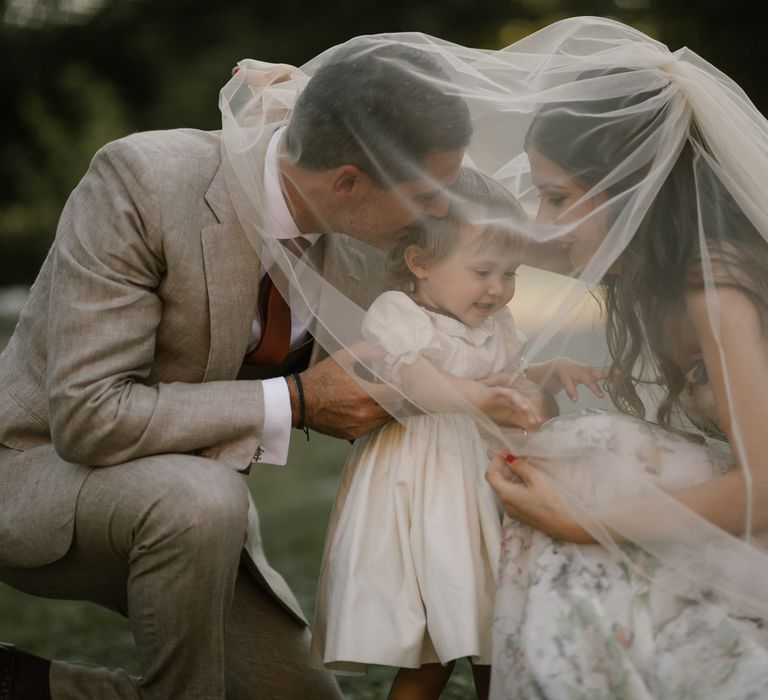 Bride in Strapless Embroidered Wedding Dress by Rara Avis | Groom in Beige Suit with Ochre Tie | Flower Girl in White Dress | Fairytale Tuscan Wedding with Bride in Embroidered Dress | Andrea &amp; Federica Photography