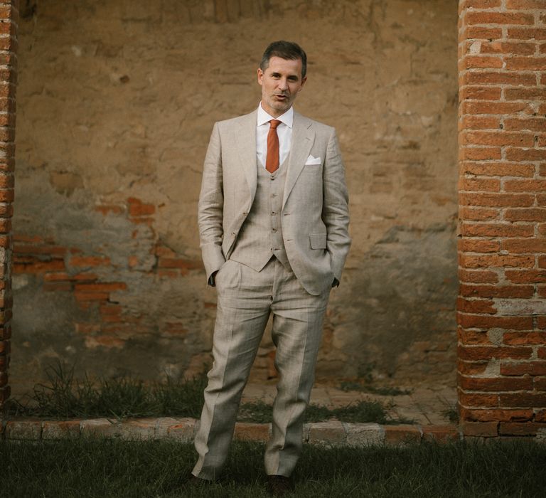 Groom in Beige Suit with Ochre Tie | Fairytale Tuscan Wedding with Bride in Embroidered Dress | Andrea &amp; Federica Photography