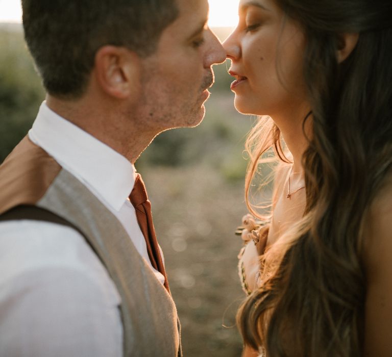 Bride in Strapless Embroidered Wedding Dress by Rara Avis | Groom in Beige Suit with Ochre Tie | Golden Hour | Fairytale Tuscan Wedding with Bride in Embroidered Dress | Andrea &amp; Federica Photography