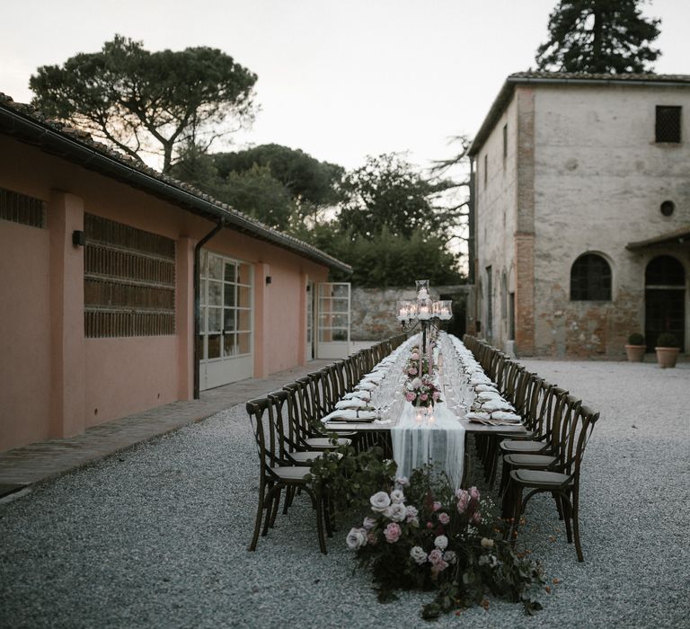 Wedding Reception Decor | Romantic Table Flowers | Soft Linen Table Runner | Burnished Iron Candlesticks | Pink Tapered Candles | Fairytale Tuscan Wedding with Bride in Embroidered Dress | Andrea &amp; Federica Photography