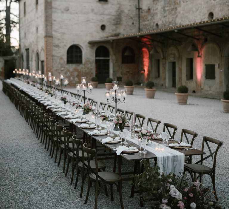 Wedding Reception Decor | Romantic Table Flowers | Soft Linen Table Runner | Burnished Iron Candlesticks | Pink Tapered Candles | Fairytale Tuscan Wedding with Bride in Embroidered Dress | Andrea &amp; Federica Photography