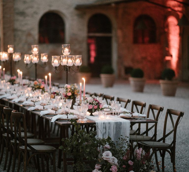 Wedding Reception Decor | Romantic Table Flowers | Soft Linen Table Runner | Burnished Iron Candlesticks | Pink Tapered Candles | Fairytale Tuscan Wedding with Bride in Embroidered Dress | Andrea &amp; Federica Photography