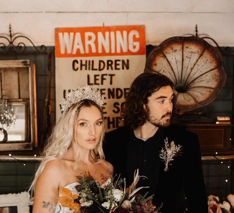 Alternative bride and groom with bride in bridal gown