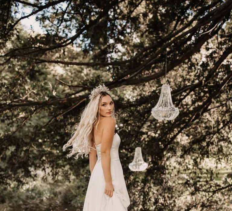 Bride in strapless wedding dress with jewelled crown